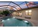 A beautiful screened-in pool and spa featuring ample seating space and an outdoor lounge at sunset at 14216 Florida Rosemary Dr, Bradenton, FL 34211