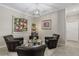 Comfortable sitting area with seating for four, tile flooring, and art creating a cozy, inviting space at 14216 Florida Rosemary Dr, Bradenton, FL 34211