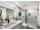 Modern bathroom with sleek vanity, glass-enclosed shower, and contemporary fixtures at 1445 Gulf Of Mexico Dr # 203, Longboat Key, FL 34228