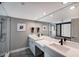 Modern bathroom features dual sinks, sleek countertops, and stylish fixtures at 1445 Gulf Of Mexico Dr # 203, Longboat Key, FL 34228