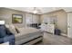 Serene bedroom featuring a cozy bed, dresser, nautical decor, and pleasant natural light at 1445 Gulf Of Mexico Dr # 203, Longboat Key, FL 34228