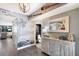 Charming hallway featuring decorative elements, wood-look floors, and an artistic wall mural at 1445 Gulf Of Mexico Dr # 203, Longboat Key, FL 34228