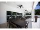 Covered patio with ceiling fans, recessed lighting, and outdoor dining furniture, perfect for entertaining or relaxing at 1445 Gulf Of Mexico Dr # 203, Longboat Key, FL 34228