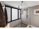 Elegant walk-in shower with glass enclosure and rain shower head at 1445 Gulf Of Mexico Dr # 203, Longboat Key, FL 34228