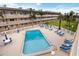 Aerial view of complex pool, lounge chairs, and tables for community use at 150 Harborside Ave # 307, Punta Gorda, FL 33950