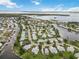 Stunning aerial view of the waterfront neighborhood, highlighting the canal and nearby water at 150 Harborside Ave # 307, Punta Gorda, FL 33950