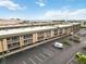 Aerial view of condo complex with parking and bay views at 150 Harborside Ave # 307, Punta Gorda, FL 33950