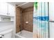 A fully tiled bathtub/shower and vanity cabinet enhance the functionality and appeal of this bathroom at 150 Harborside Ave # 307, Punta Gorda, FL 33950
