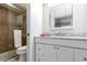 Bathroom featuring a glass shower, white vanity with marble countertop at 150 Harborside Ave # 307, Punta Gorda, FL 33950