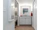 Bright bathroom featuring a white vanity with marble countertop and tiled floor at 150 Harborside Ave # 307, Punta Gorda, FL 33950