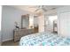 Bedroom showcasing a dresser with mirror and convenient access to other rooms at 150 Harborside Ave # 307, Punta Gorda, FL 33950