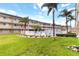 Serene pool area framed by lush landscaping and a well-maintained condo building exterior at 150 Harborside Ave # 307, Punta Gorda, FL 33950