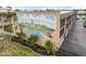 Aerial view showcases the building's mural, mature landscaping and prime location at 150 Harborside Ave # 307, Punta Gorda, FL 33950