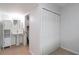 Hallway featuring a closet and an entrance to the bathroom with vanity and toilet at 150 Harborside Ave # 307, Punta Gorda, FL 33950