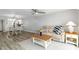 Bright living room showcasing hardwood floors, an adjacent kitchen, and neutral decor at 150 Harborside Ave # 307, Punta Gorda, FL 33950