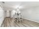 The dining area features an open layout to the kitchen, adjacent to both the living room and hallway entrance at 150 Harborside Ave # 307, Punta Gorda, FL 33950