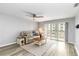 Comfortable living room with a fan, sliding doors to balcony, and a cozy seating area at 150 Harborside Ave # 307, Punta Gorda, FL 33950