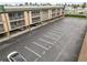 Aerial view showcases the building's parking lot, mature landscaping and prime location at 150 Harborside Ave # 307, Punta Gorda, FL 33950