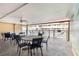 Outdoor patio with tables and chairs with view of fenced community pool at 150 Harborside Ave # 307, Punta Gorda, FL 33950