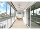 Bright sunroom featuring tiled floors, seating area, and expansive view at 150 Harborside Ave # 307, Punta Gorda, FL 33950