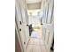 Hallway view of a functional bathroom with a tub-shower combo and dark vanity at 1539 Ormond Ter, Parrish, FL 34219