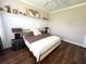 Spacious bedroom with modern decor and a large bed with stylish bedding and decor at 1539 Ormond Ter, Parrish, FL 34219