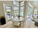 Bright breakfast nook with pool view through large windows at 1539 Ormond Ter, Parrish, FL 34219