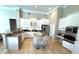 Spacious white kitchen featuring modern appliances and a central island with seating at 1539 Ormond Ter, Parrish, FL 34219