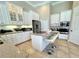 Bright kitchen with white cabinets, granite countertops, and stainless steel appliances at 1539 Ormond Ter, Parrish, FL 34219