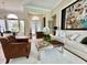 Spacious living room featuring designer furniture, stylish accents, and an open layout ideal for modern living at 1539 Ormond Ter, Parrish, FL 34219