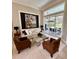 Bright and airy living room with a comfortable sofa, elegant decor, and a seamless transition to the outdoor pool area at 1539 Ormond Ter, Parrish, FL 34219