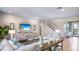 Open-concept living room with stylish decor, a comfortable couch, and plenty of space for relaxation at 17924 Tavernside Trl, Bradenton, FL 34211