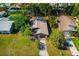 Aerial view of the home's layout among neighborhood, highlighting roof and lot size at 1862 Rita St, Sarasota, FL 34231