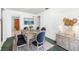 Inviting dining room with a wooden table, six chairs, and stylish decor at 1862 Rita St, Sarasota, FL 34231
