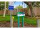 Vamo Drive Park entrance with well-maintained lawn, signage, and visible park rules at 1862 Rita St, Sarasota, FL 34231