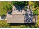 Durable roof structure ensuring safety and longevity, nestled amidst lush greenery and providing energy efficiency at 1862 Rita St, Sarasota, FL 34231