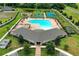 Aerial view of community pool, tennis, and basketball courts at 18620 Cortes Creek Blvd, Spring Hill, FL 34610