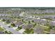 Aerial view of a residential neighborhood with tree-lined streets at 18620 Cortes Creek Blvd, Spring Hill, FL 34610