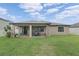 Spacious backyard with covered patio and well maintained lawn at 18620 Cortes Creek Blvd, Spring Hill, FL 34610