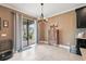 Bright breakfast nook with a view to the backyard and a modern hanging light fixture at 18620 Cortes Creek Blvd, Spring Hill, FL 34610