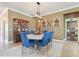 Elegant dining room showcases a dining set for six and stylish decorative elements at 18620 Cortes Creek Blvd, Spring Hill, FL 34610