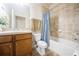 Cozy bathroom featuring a tub, toilet, and decorative fixtures at 1905 Via Napoli St, Plant City, FL 33566