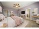 Digitally staged primary bedroom showcasing contemporary design and a calming aesthetic at 1905 Via Napoli St, Plant City, FL 33566