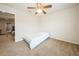 A small bedroom with a simple daybed, ceiling fan, and doorway views into the other rooms at 1905 Via Napoli St, Plant City, FL 33566