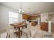 Kitchen with stainless steel appliances, granite countertops, wood cabinets and a dining table at 1905 Via Napoli St, Plant City, FL 33566