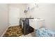 Functional laundry room with modern washer and dryer, a utility sink, and practical shelving at 1905 Via Napoli St, Plant City, FL 33566