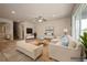 Bright, staged living room featuring neutral tones, comfortable seating, and a serene atmosphere at 1905 Via Napoli St, Plant City, FL 33566