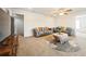 Spacious living room with two sofas, a decorative rug, and ample natural light at 1905 Via Napoli St, Plant City, FL 33566