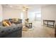 Cozy living room with a comfortable sofa, round rug, and ample space for relaxation at 1905 Via Napoli St, Plant City, FL 33566