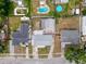 Aerial view of home featuring backyard with pool, pond and landscaping at 2214 Elise Marie Dr, Seffner, FL 33584